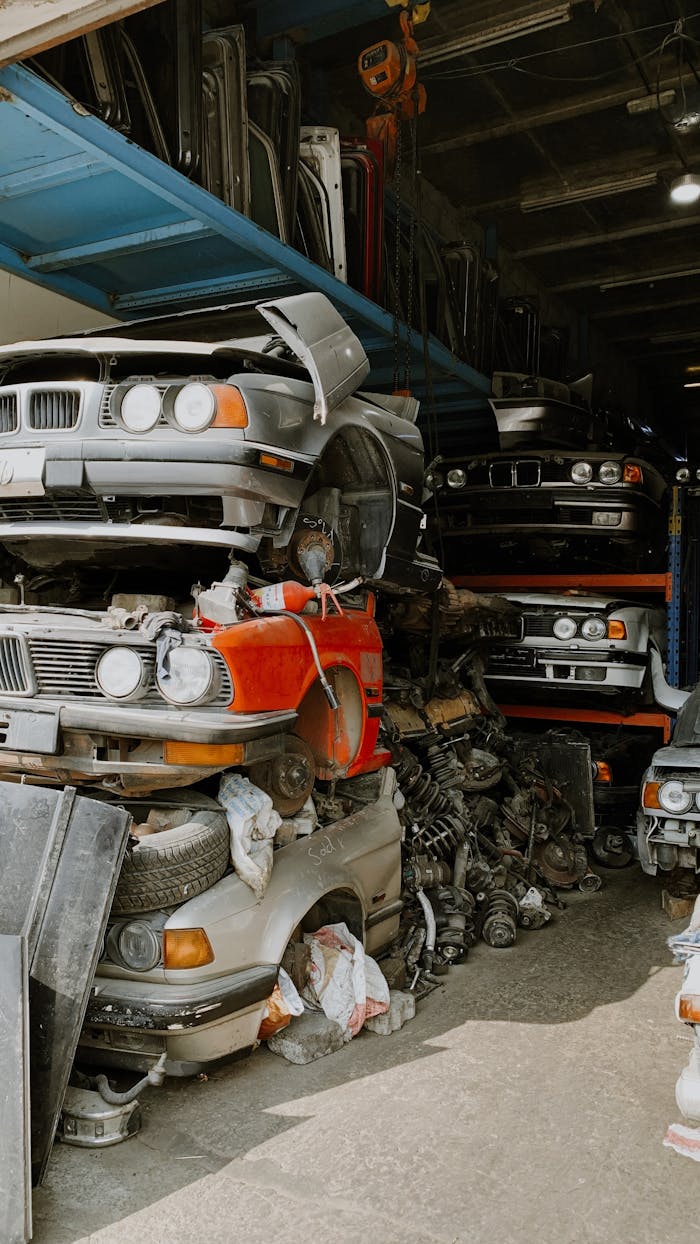 A pile of stacked cars in a junkyard in Sharjah, UAE.